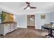 Bright dining room featuring hardwood floors, blue walls, ceiling fan, and an antique sideboard at 1468 N Relyea Ave, Charleston, SC 29412