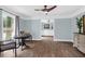 Sun-filled dining room with hard wood floors, and a round table set near a window at 1468 N Relyea Ave, Charleston, SC 29412
