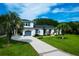 This home has a wide driveway and manicured green front yard at 1468 N Relyea Ave, Charleston, SC 29412