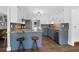 Well-lit kitchen showcases stainless steel appliances, granite countertops, and modern cabinets at 1468 N Relyea Ave, Charleston, SC 29412