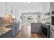 Modern kitchen with gray backsplash, stainless steel appliances, and granite countertops at 1468 N Relyea Ave, Charleston, SC 29412