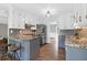 Bright kitchen features granite countertops, stainless steel appliances, and two-toned cabinets at 1468 N Relyea Ave, Charleston, SC 29412
