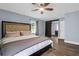 Spacious bedroom featuring hardwood floors, a king sized bed, and access to en-suite bathroom at 1468 N Relyea Ave, Charleston, SC 29412