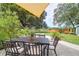 Charming outdoor patio featuring a dining table and chairs, perfect for outdoor entertaining at 1468 N Relyea Ave, Charleston, SC 29412
