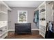 Bright walk-in closet features custom shelving, cabinets, wood floor, and a window for natural light at 1468 N Relyea Ave, Charleston, SC 29412