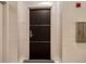 Modern apartment door with sleek design, set against a textured wall with a fire safety box at 149 Cooper River Dr, Mount Pleasant, SC 29464