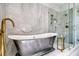 Luxurious bathroom showcasing a freestanding tub, a glass-enclosed shower and marble walls at 149 Cooper River Dr, Mount Pleasant, SC 29464