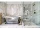 Luxurious bathroom showcasing a freestanding tub, a glass-enclosed shower and marble walls at 149 Cooper River Dr, Mount Pleasant, SC 29464