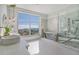Well-lit main bathroom showcasing a freestanding tub, a glass-enclosed shower and marble walls at 149 Cooper River Dr, Mount Pleasant, SC 29464