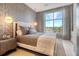 Comfortable bedroom featuring a queen-sized bed, nightstands, and a large window at 149 Cooper River Dr, Mount Pleasant, SC 29464