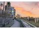 Luxury condos overlooking a scenic walkway and marsh views at sunset at 149 Cooper River Dr, Mount Pleasant, SC 29464