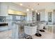 Sleek kitchen with marble countertops, pendant lighting, stainless steel appliances, and stylish bar stool seating at 149 Cooper River Dr, Mount Pleasant, SC 29464