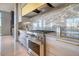 Close-up of gourmet kitchen with stainless steel range, marble backsplash, and sleek cabinetry at 149 Cooper River Dr, Mount Pleasant, SC 29464