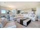 Expansive living room with plush seating, modern decor, and an open layout with seamless flow into the kitchen area at 149 Cooper River Dr, Mount Pleasant, SC 29464