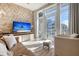 Bright living room with stunning views, wood accent wall, and modern furnishings at 149 Cooper River Dr, Mount Pleasant, SC 29464