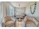Well-lit main bedroom featuring a four poster bed, decorative seating, and stunning decor at 149 Cooper River Dr, Mount Pleasant, SC 29464