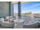 Inviting outdoor seating area with comfortable sofas and beautiful views of Ravenel Bridge at 149 Cooper River Dr, Mount Pleasant, SC 29464