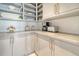 Walk-in pantry features custom shelving, marble countertop, and designer hardware at 149 Cooper River Dr, Mount Pleasant, SC 29464