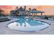 Sparkling pool area with lounge seating and a covered gazebo, surrounded by palm trees at 149 Cooper River Dr, Mount Pleasant, SC 29464