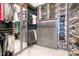 Spacious walk-in closet featuring custom shelving, drawers, and mirrored doors at 149 Cooper River Dr, Mount Pleasant, SC 29464