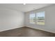 This bedroom features wood flooring and windows providing natural light at 156 Haventree Ct, Summerville, SC 29486