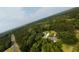Scenic aerial view featuring home with a pond, barn, and wooded landscape at 1613 Cavanaugh Rd, Walterboro, SC 29488