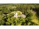 Overhead view of home with large barn and pond surrounded by mature trees at 1613 Cavanaugh Rd, Walterboro, SC 29488