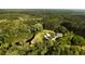 Stunning aerial view of a home nestled amidst lush greenery and surrounded by a serene pond at 1613 Cavanaugh Rd, Walterboro, SC 29488
