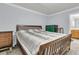 Comfortable bedroom with a wood-framed bed, neutral walls, and practical furnishings, creating a cozy retreat at 1613 Cavanaugh Rd, Walterboro, SC 29488