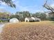Well-maintained home exterior featuring a shed and expansive lawn, offering ample outdoor space and storage at 1613 Cavanaugh Rd, Walterboro, SC 29488