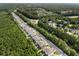 Picturesque aerial view of a neighborhood with lush greenery, roundabout, and well-maintained homes at 1682 Mermentau St, Mount Pleasant, SC 29466