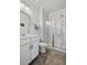 Bathroom featuring a glass enclosed shower, modern sink, and sleek tile floors at 1682 Mermentau St, Mount Pleasant, SC 29466