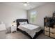 Comfortable bedroom featuring a queen-size bed, a ceiling fan, and a bright window at 1682 Mermentau St, Mount Pleasant, SC 29466