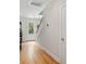 Bright entryway featuring hardwood floors, white walls, and a view of the front door and staircase at 1682 Mermentau St, Mount Pleasant, SC 29466