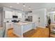 Bright kitchen featuring white cabinets, granite countertops, stainless steel appliances, and hardwood floors at 1682 Mermentau St, Mount Pleasant, SC 29466