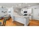 Spacious kitchen featuring a large island, white cabinetry, stainless steel appliances, and hardwood floors at 1682 Mermentau St, Mount Pleasant, SC 29466