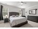 Spacious main bedroom featuring neutral carpeting, a ceiling fan, and a large dresser at 1682 Mermentau St, Mount Pleasant, SC 29466