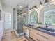 Modern bathroom with double vanity, and a sleek glass-enclosed shower at 1685 Old Military Rd, Charleston, SC 29412