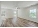 Bright bedroom with recessed lighting features a ceiling fan and three large windows at 1685 Old Military Rd, Charleston, SC 29412
