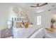 Bright bedroom featuring a comfortable bed, stylish decor, and ceiling fan at 1685 Old Military Rd, Charleston, SC 29412