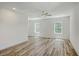 Bright bedroom features wood-look floors, two windows and neutral paint scheme at 1685 Old Military Rd, Charleston, SC 29412