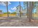 Rear exterior view of the home with a fenced-in yard at 1685 Old Military Rd, Charleston, SC 29412