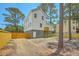 Backyard view featuring the home's exterior with a fenced yard at 1685 Old Military Rd, Charleston, SC 29412