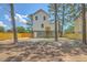Rear exterior view of the home with a fenced-in yard at 1685 Old Military Rd, Charleston, SC 29412