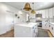 Bright kitchen featuring white cabinetry, stainless steel appliances, and a large island with a quartz countertop at 1685 Old Military Rd, Charleston, SC 29412