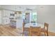 Open kitchen with white cabinets, stainless appliances, and a center island at 1685 Old Military Rd, Charleston, SC 29412