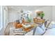 Inviting living room featuring a leather sofa, decorative pillows, and hardwood floors at 1685 Old Military Rd, Charleston, SC 29412