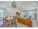 Stylish open-concept living space featuring modern furnishings, a dining area, and plenty of natural light at 1685 Old Military Rd, Charleston, SC 29412