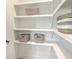 Walk-in pantry with bright white shelving and decorative woven baskets at 1685 Old Military Rd, Charleston, SC 29412