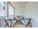 Charming porch with modern seating arrangement and a small wooden table, ideal for relaxation at 1685 Old Military Rd, Charleston, SC 29412